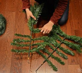 A husband and wife take apart a fake tree for this brilliant porch idea