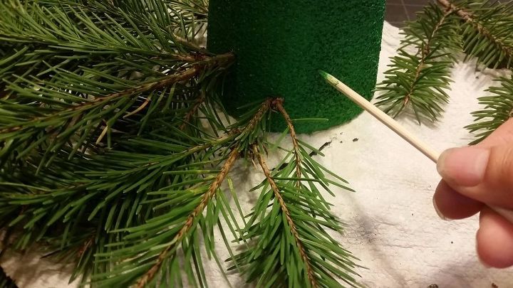make a faux diy christmas tree with real branches, But wait A little hole will go a long way