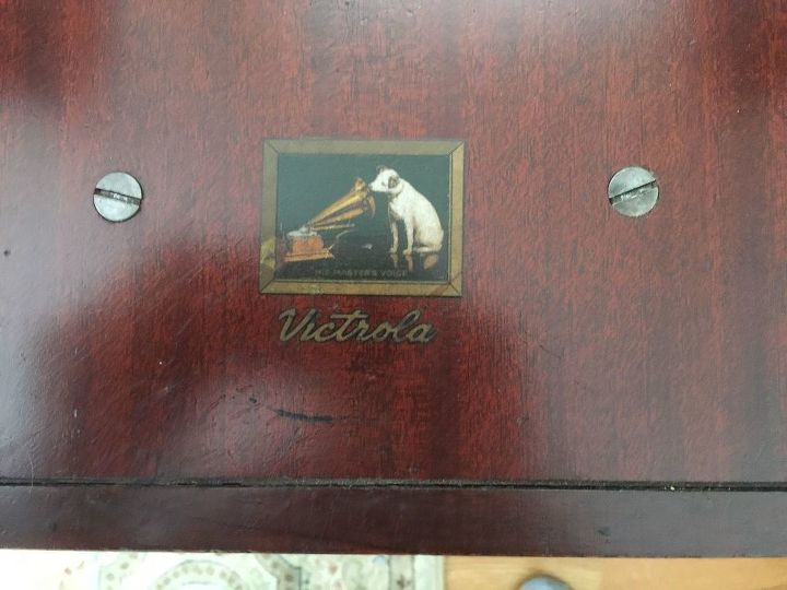 record cabinet repurposed into a wine bar , kitchen cabinets, kitchen design, outdoor living, RCA logo on the inside of the fold down front