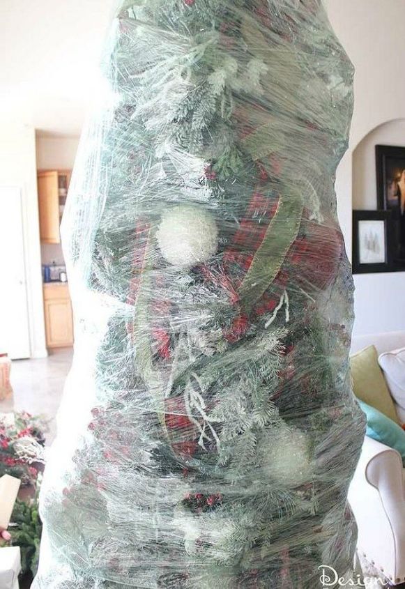 s don t put away your christmas decorations before you see these hacks, christmas decorations, Wrap your tree with heavy duty stretch wrap