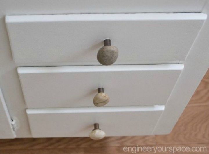 s upgrade your boring cabinets with these 11 knob ideas, kitchen cabinets, kitchen design, Add a touch of rustic to them with stones