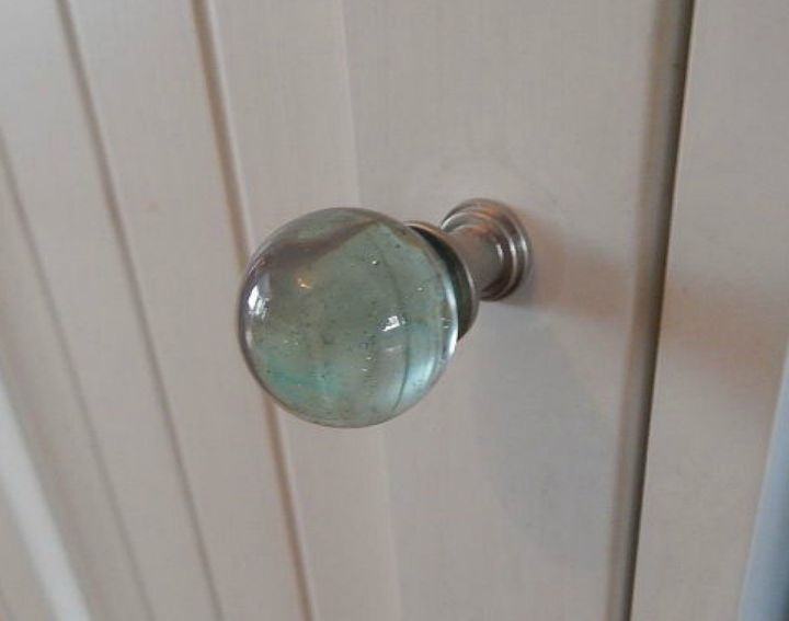 s upgrade your boring cabinets with these 11 knob ideas, kitchen cabinets, kitchen design, Attach a marble to them for a glassy effect