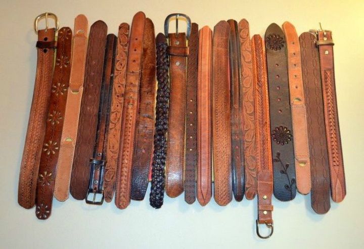 cut up old belts for these 13 amazing decor ideas, Paste them together as wall art