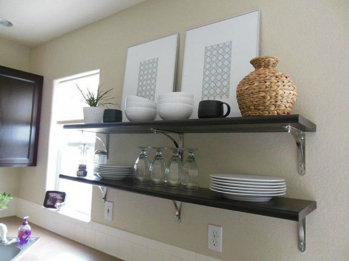 15 clever ways to add more kitchen storage space with open shelves, Use them to display artwork