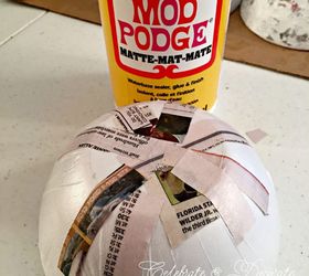 paper maché bowl, covered with vintage book pages (i just f…