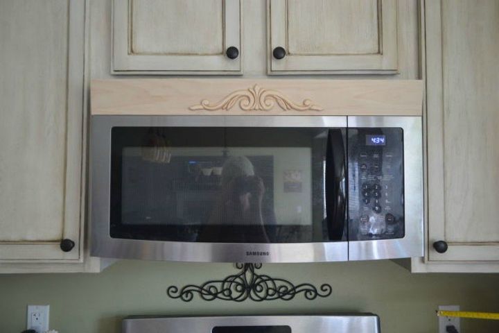 fake a gorgeous built in kitchen with these 13 hacks, Glue an applique to your microwave vent