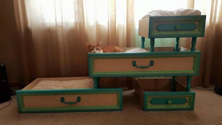 pull drawers out of your dressers for these 13 brilliant ideas, Fashion them into a tiered cat bed
