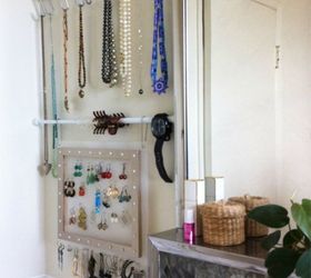 s why you should use hanging storage from now on 13 ways, storage ideas, Use tensions rods to hang jewelry