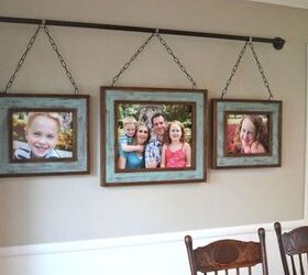 s show off your family photos with these 16 creative ideas, Or hang a few off a rustic iron pipe