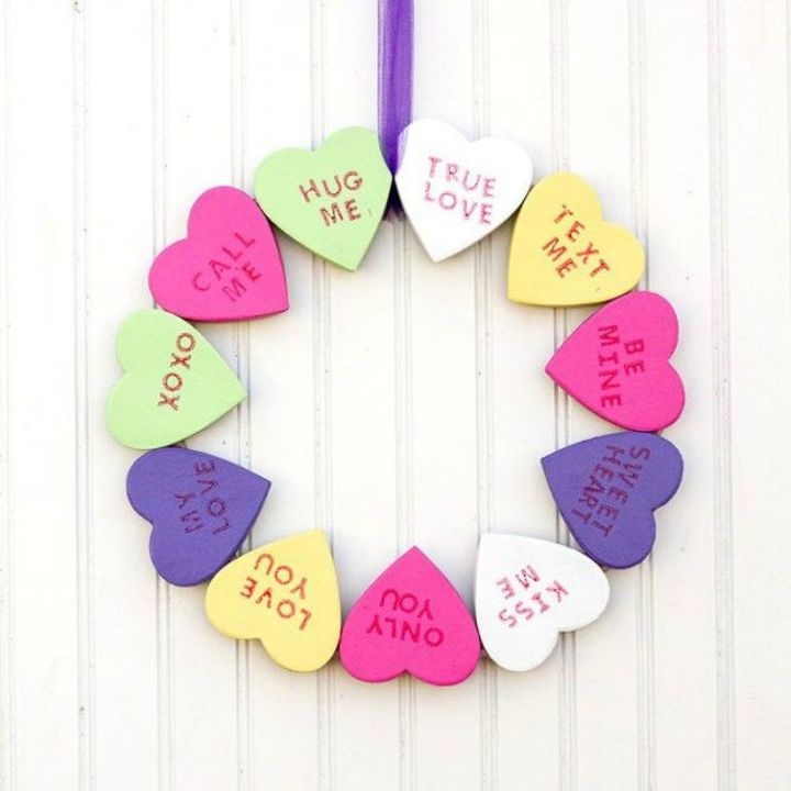 s dress your door for valentine s with these 20 beautiful wreaths, crafts, doors, seasonal holiday decor, valentines day ideas, wreaths, This one made with conversation hearts
