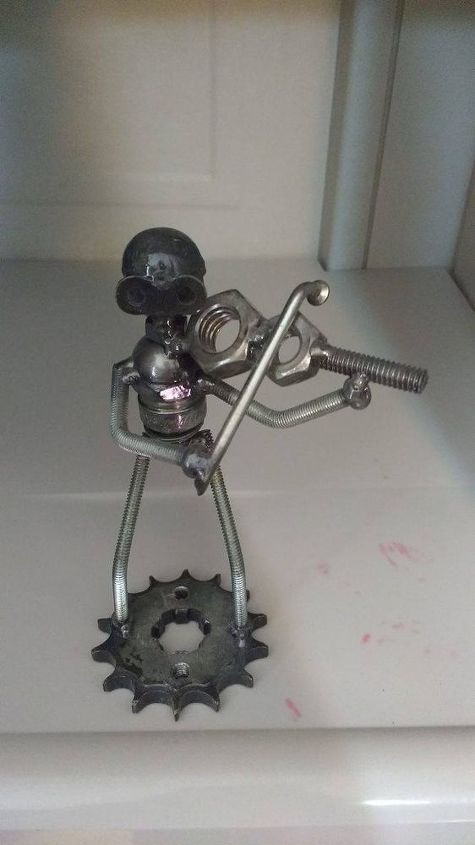 q feeling proud of my friend little statue made from nuts and bolts