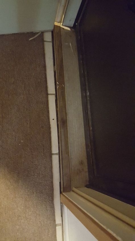 q space between front entry doorway threshold and flooring, flooring