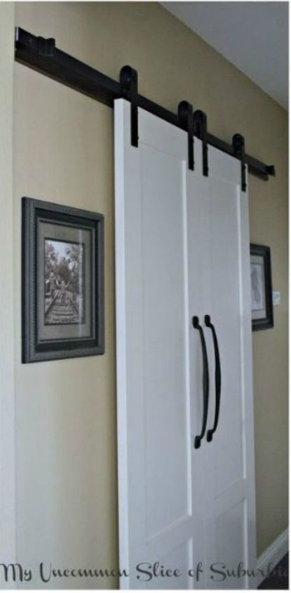 11 ways to update your dark and dingy laundry room for under 100, Dress up your entryway with a barndoor