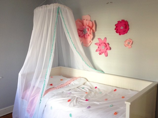 If you prefer, there are many options for crafting your own canopy bed curtains right at home such as this hula hoop canopy