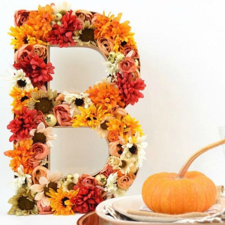 tired of wreaths here are 11 cute ways to decorate with faux flowers, Fill a cardboard letter with summer blooms