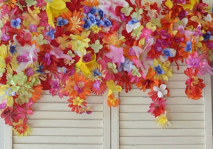 tired of wreaths here are 11 cute ways to decorate with faux flowers, Mount a flower banner above your porch