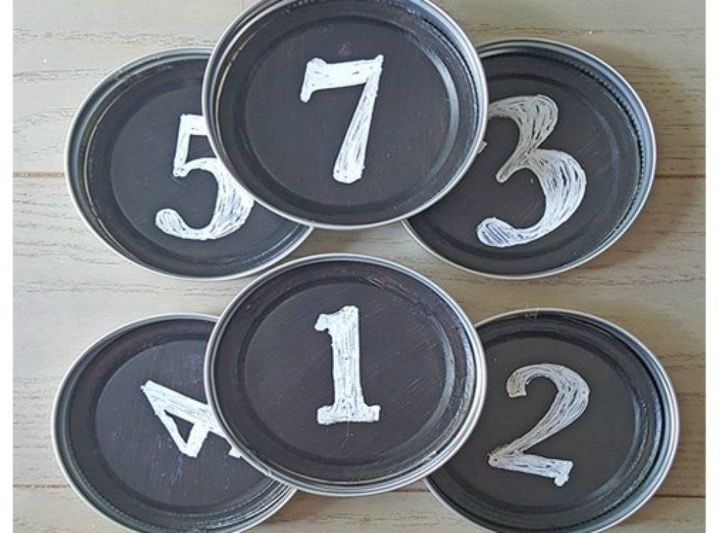s 14 awesome things you didn t know you could do with jar and tin lids, Paint them into chalkboard coasters