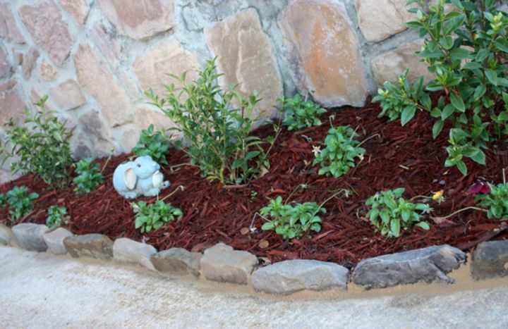 s 11 impressive ways to update your home with stone, concrete masonry, home decor, Create a pretty landscape edging