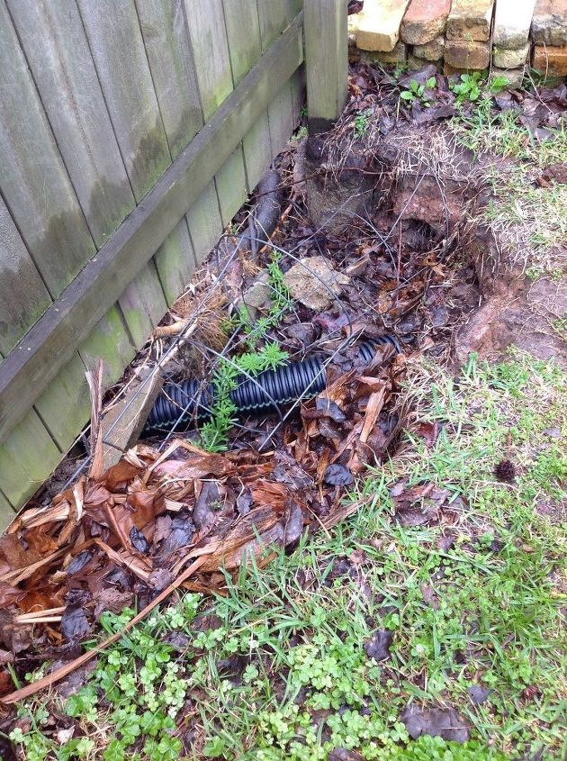 how to fix a washed out area beneath our privacy fence