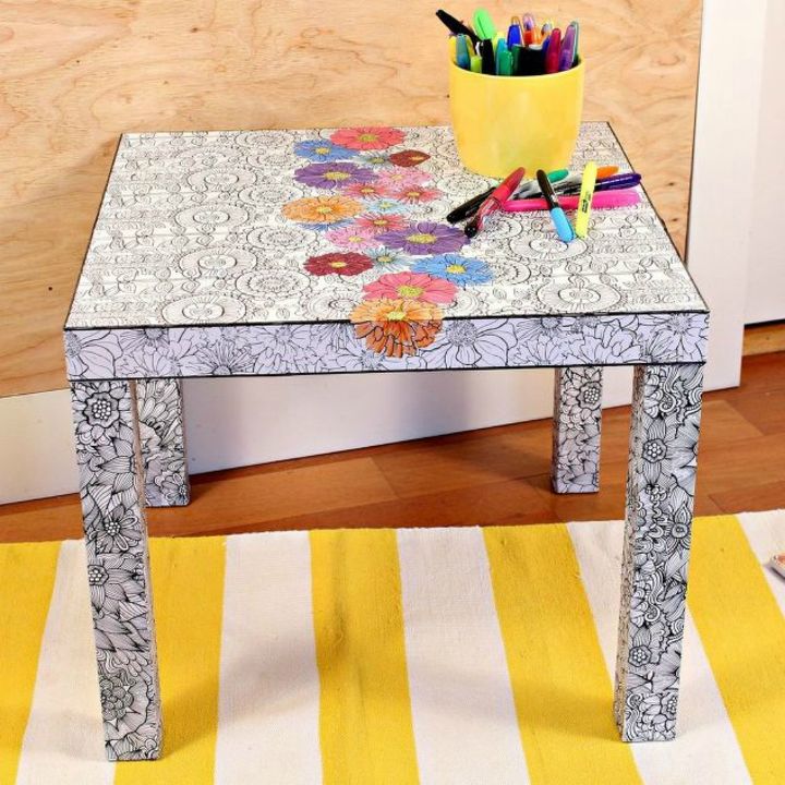 how to fake high end decor with adult coloring books, Decoupage your Ikea coffee table