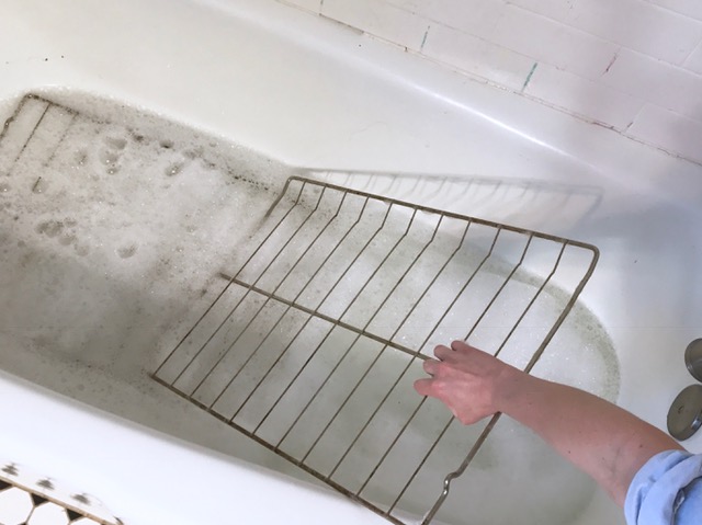 cleaning oven racks in the bathtub