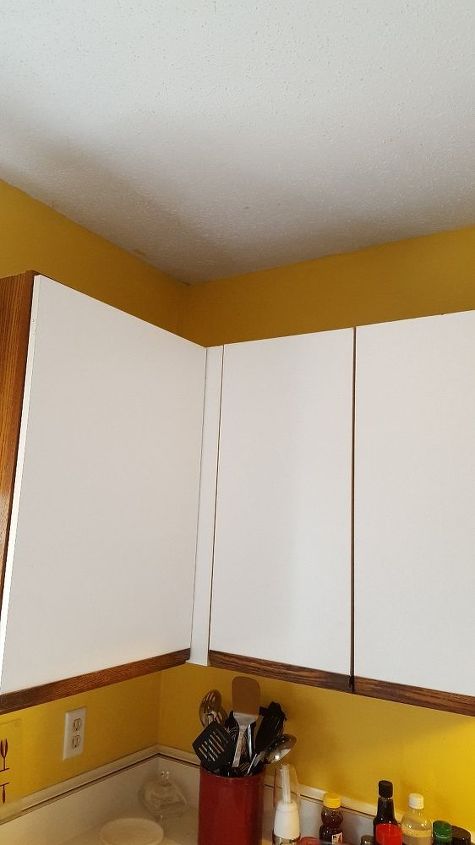 q i have the awful white kitchen cabinets what can i do to them