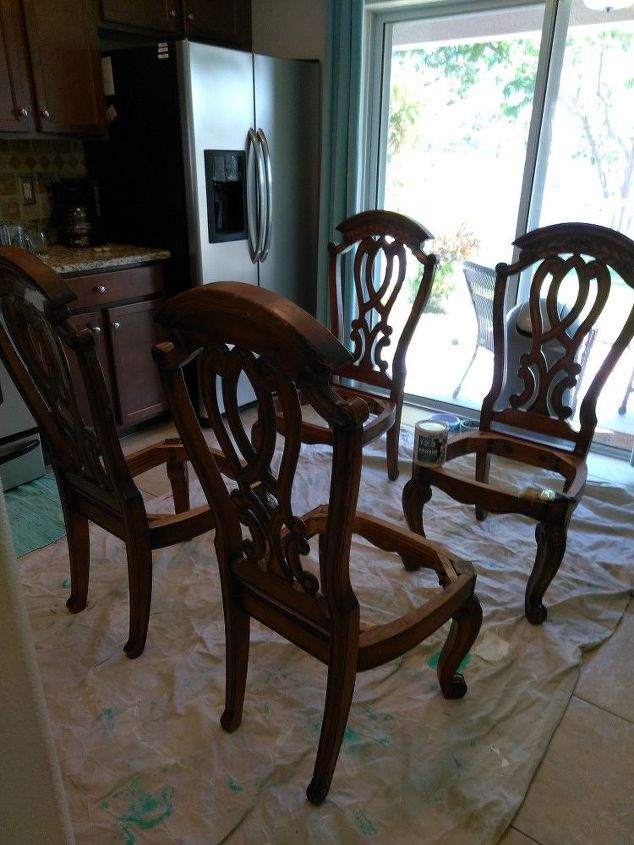 we used an old shower curtain to recover these old chairs