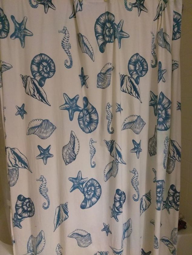we used an old shower curtain to recover these old chairs