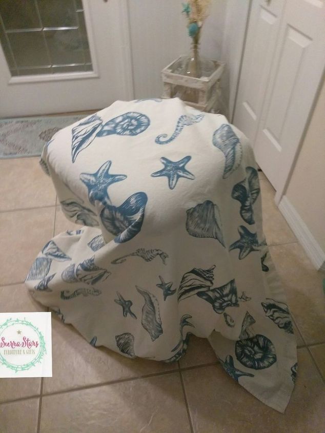 we used an old shower curtain to recover these old chairs