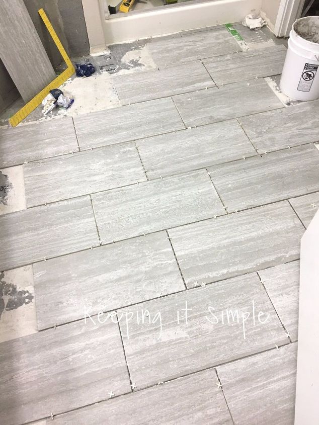 how to tile a bathroom floor with 12x24 gray tiles
