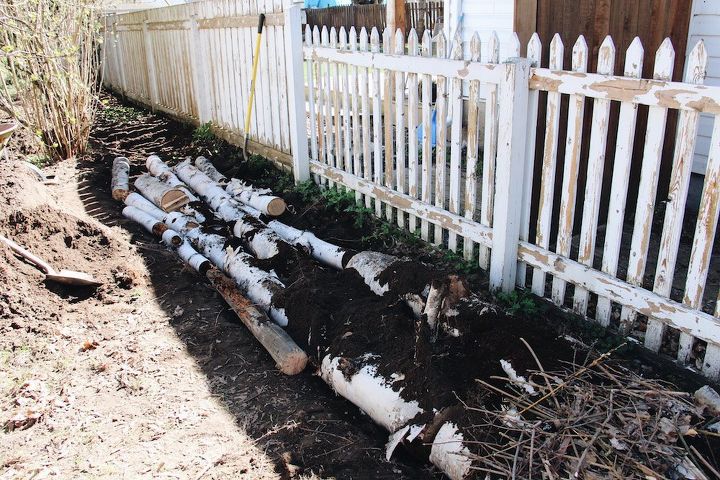 how to make an eco friendly hugelkultur raised garden bed, Place the largest logs wood in the trench