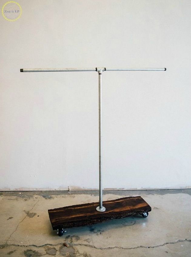 the 15 coolest ways to reuse pipes in your home decor, Attach them into a rustic clothing rack