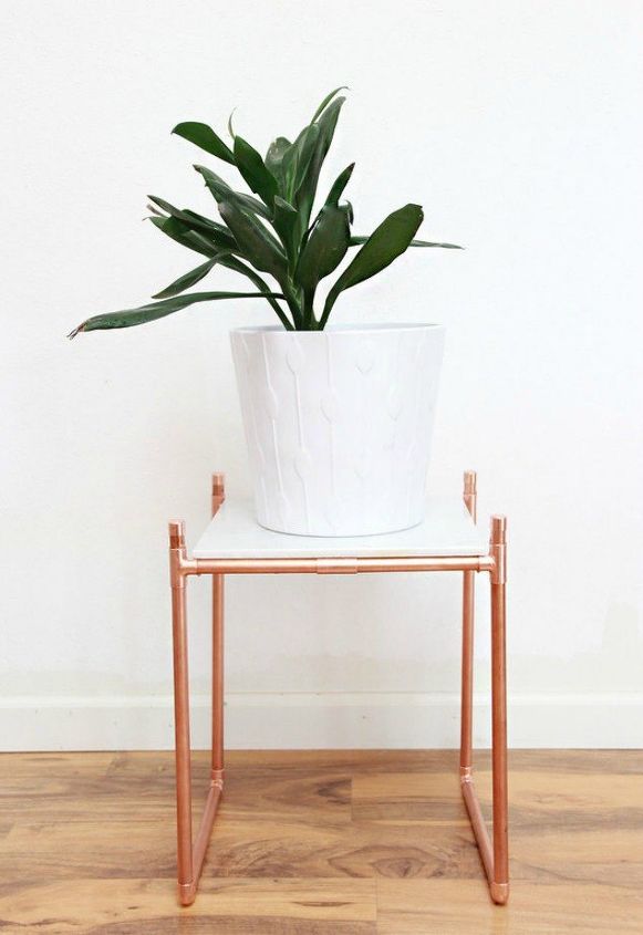 the 15 coolest ways to reuse pipes in your home decor, Turn copper pipe into a luxurious plant stand