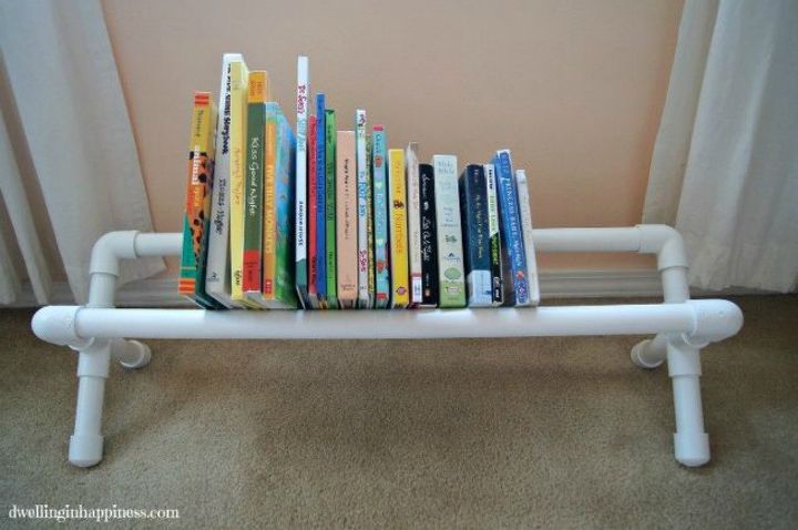 the 15 coolest ways to reuse pipes in your home decor, Stick PVC pipes into book storage