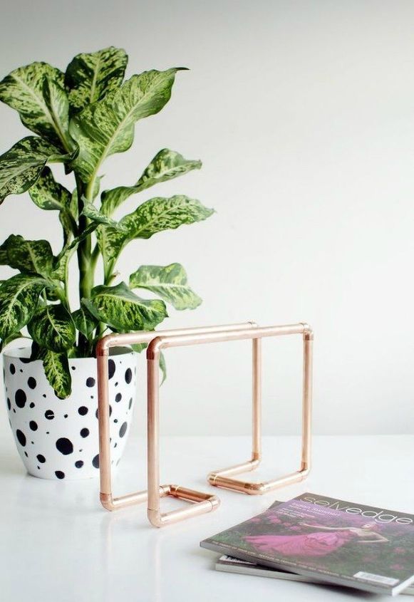 the 15 coolest ways to reuse pipes in your home decor, Build them into a magazine rack