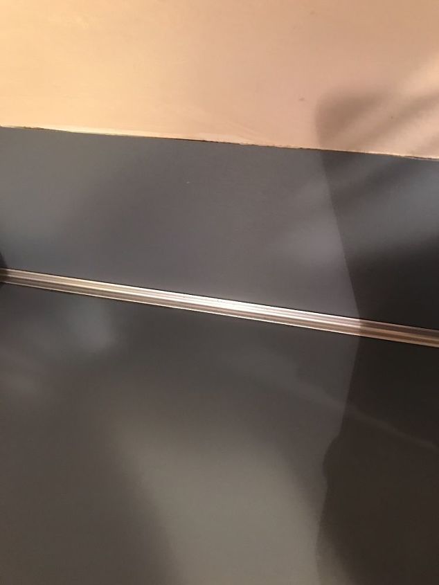 q removing metal strip between countertop and backsplash