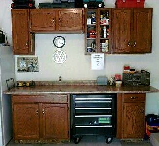 repurposed kitchen cabinets don t toss your old ones, Repurposed to the garage