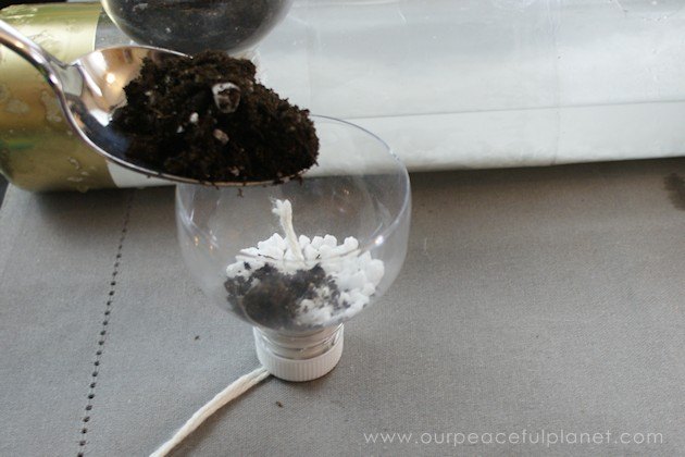 self watering planters from soda bottles