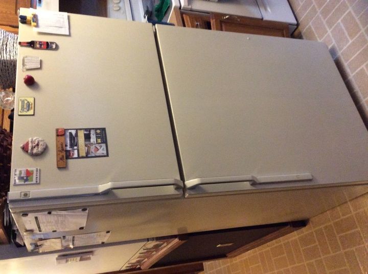 e painting a rusty fridge