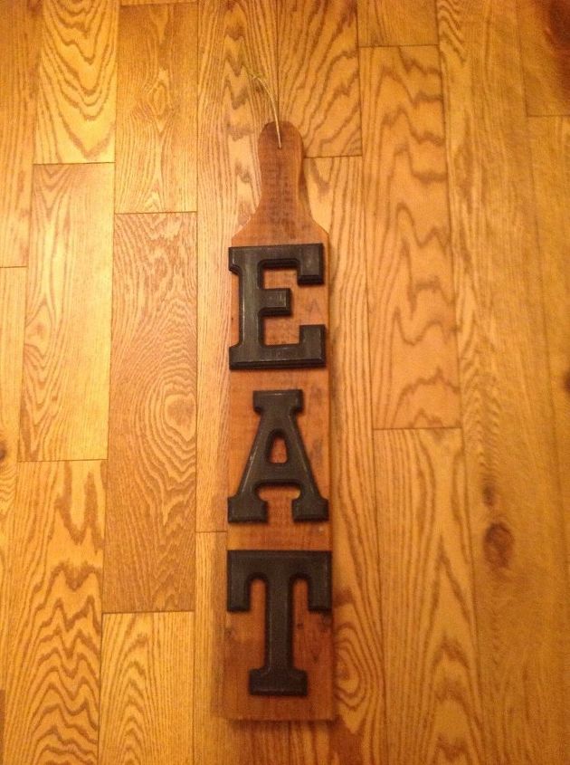 eat sign with dollar store letters on reclaimed lumber