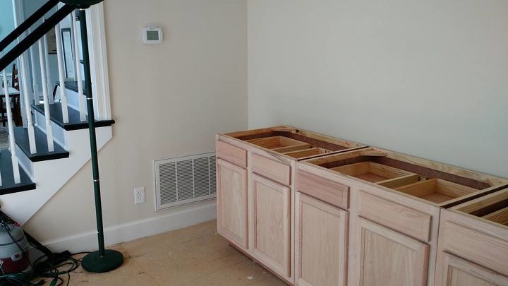 built in bookcase hack using kitchen cabinets and bookcases