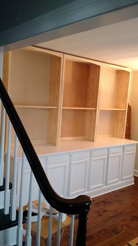 built in bookcase hack using kitchen cabinets and bookcases
