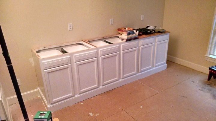 built in bookcase hack using kitchen cabinets and bookcases