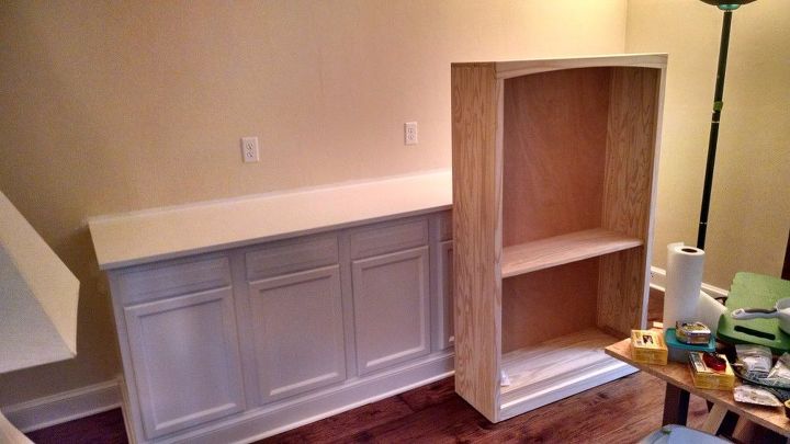 built in bookcase hack using kitchen cabinets and bookcases