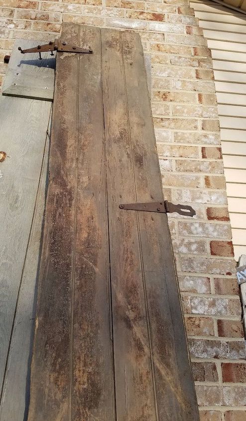 repurposed 100 yr old barn door to the bathroom