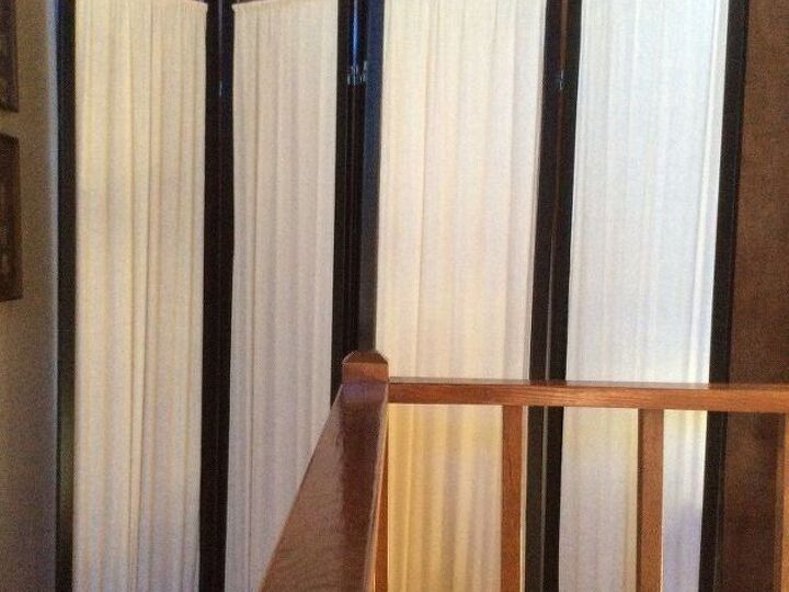q photo collage on a standing room divider