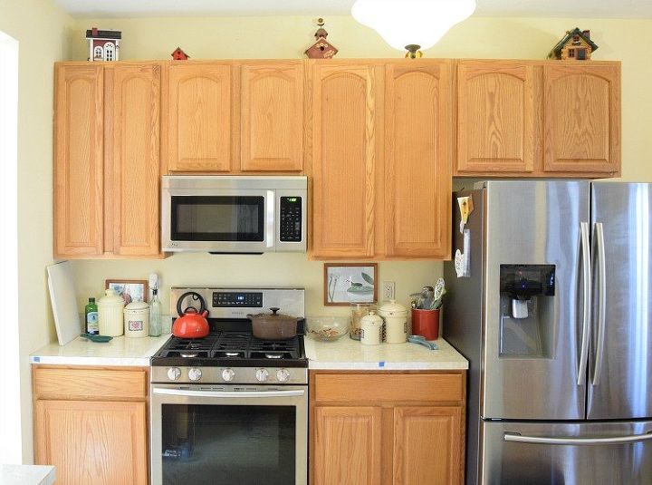 a kitchen with new white cabinets