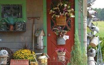 Hang a Collection of Watering Cans to Decorate a Garden Shed