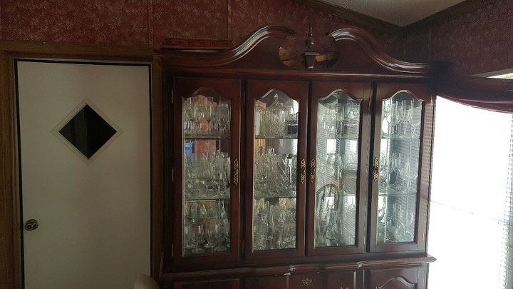 q any ideas for use of top half of glass door china cabinet