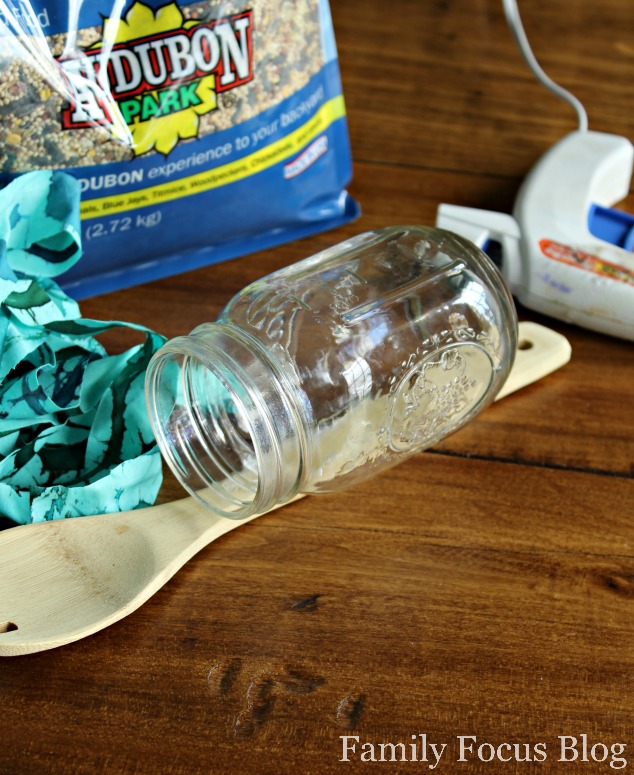 turn an old mason jar into a bird feeder